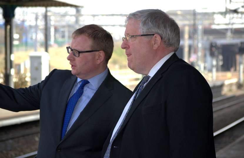 Marcus, left, with the Transport Secretary at Nuneaton train station