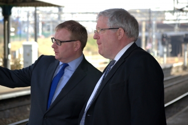 Marcus, left, with the Transport Secretary at Nuneaton train station